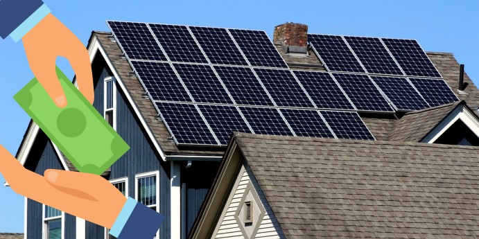 Solar panels on a house roof with hands holding cash, representing solar incentives for homeowners.